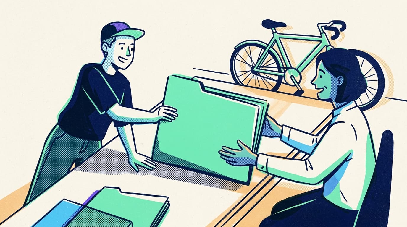 Freelance designer slides a bright mint folder across a studio table to a relieved client, with a courier bicycle leaning against the wall, afternoon light and diagonal shadows